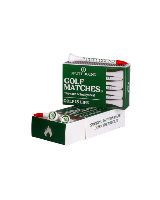 Two green golf tees from Three Putt Round's matchbox, neatly arranged on a white background.