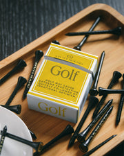 Set of three gold golf tees from Three Putt Round's Golf Addiction Tee Pack, featuring standard size and smooth finish.